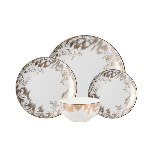 16-piece porcelain dinnerware set with intricate gold brocade detailing and classic white base.