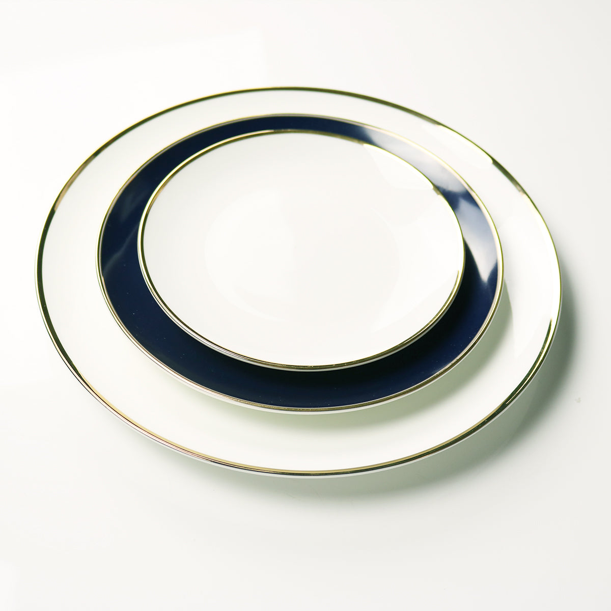 Set of 4 fine bone china bread and butter plates with narrow 14k gold rims from the Le Sofra Collection.